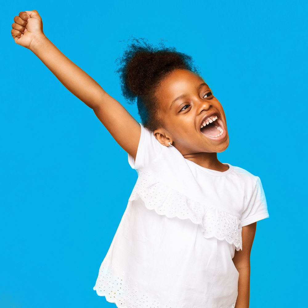 A young boy celebrating