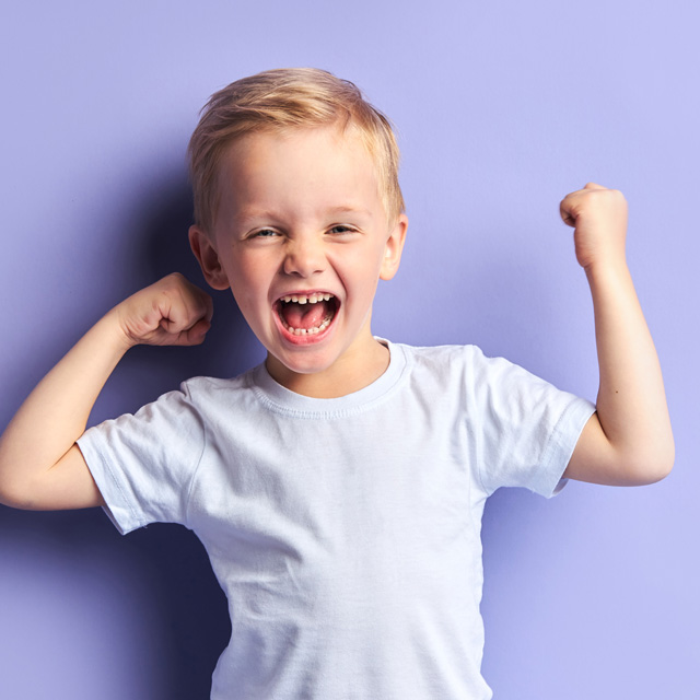 A young boy celebrating