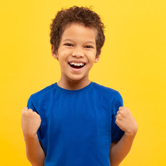 A young boy celebrating